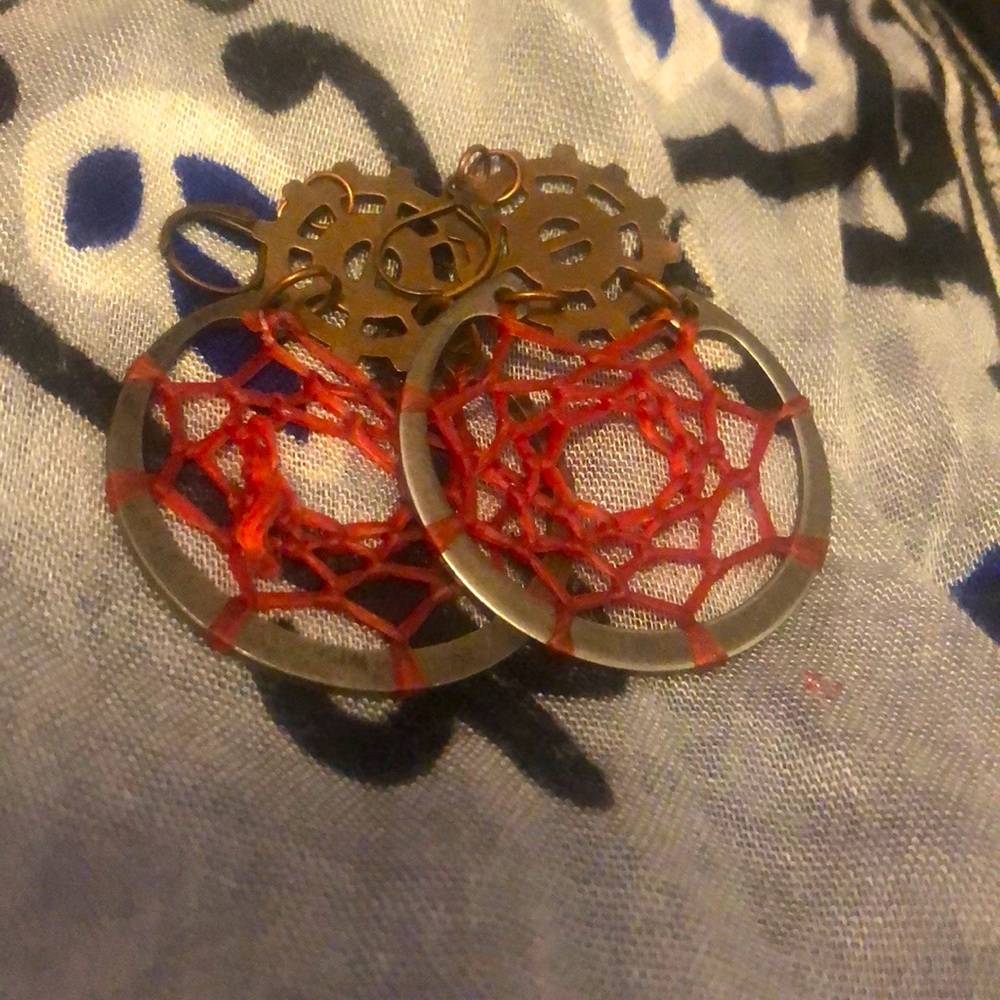A pear of red gear earrings